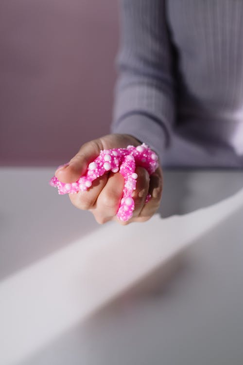 Free Close-Up Shot of a Person Holding a Pink Slime Stock Photo