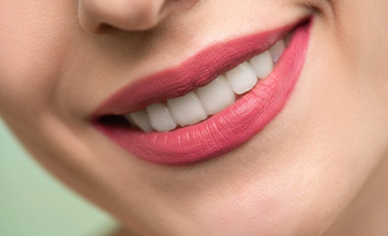 woman with red lipstick smiling