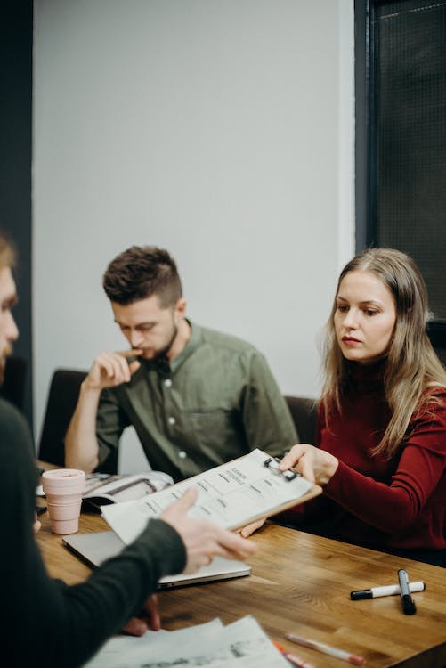 Free Man and Woman Sitting Beside Table Stock Photo