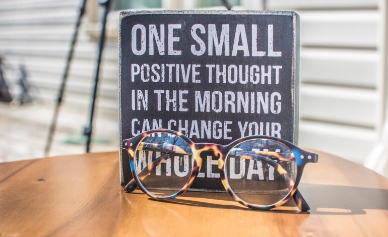 Free Photo of a Sign and Eyeglasses on Table Stock Photo