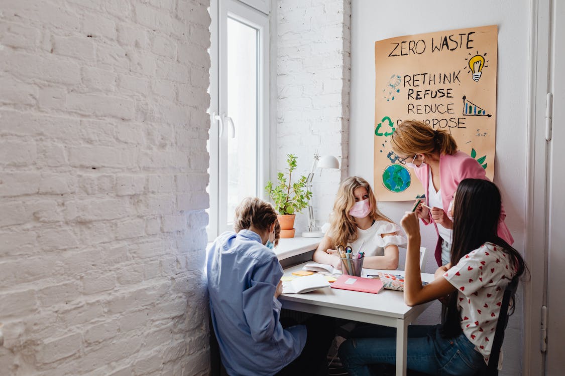 Free A Person Teaching Young Students in a Class Stock Photo