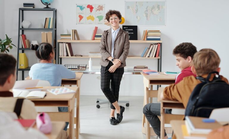 Free A Teacher Standing in the Classroom Stock Photo