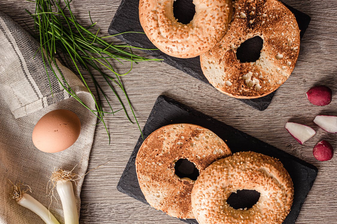 Free Bagels On Black Plates Stock Photo