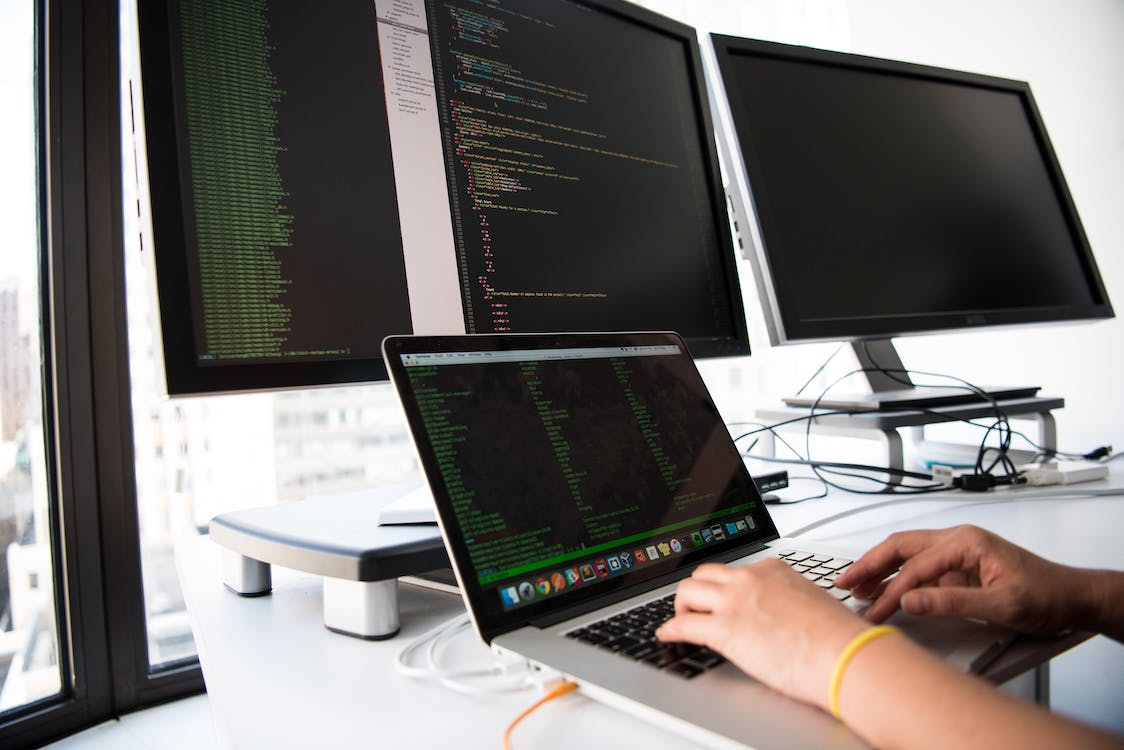 Free Close-up Photo of Person typing on Laptop Stock Photo