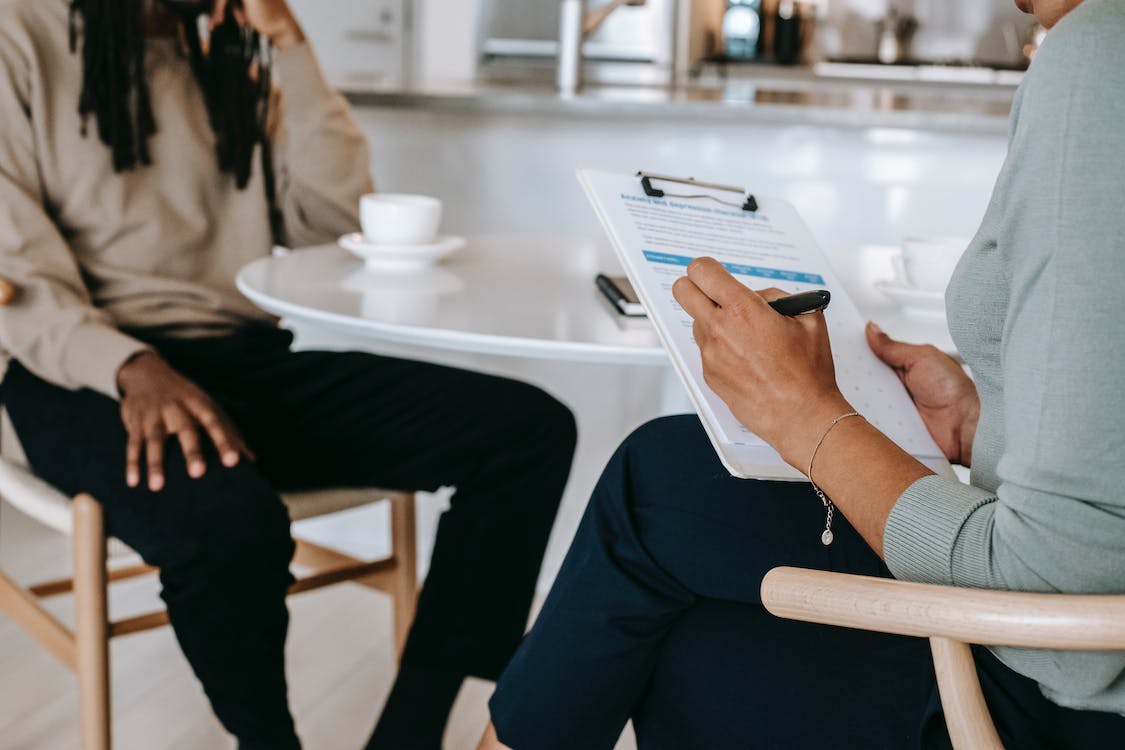 Free Crop faceless multiethnic interviewer and job seeker going through interview Stock Photo