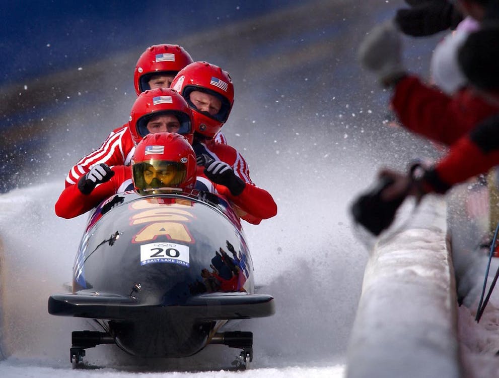 Free Four Person Riding on Snow Mobile Stock Photo