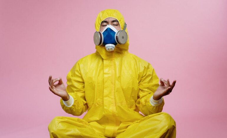 Free Man In Yellow Protective Suit Stock Photo