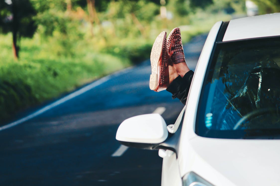 Free Person Wearing Pair of Brown Leather Loafers Stock Photo