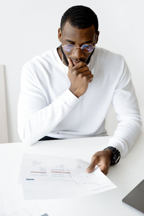 Free Photo Of Man Holding White Paper Stock Photo