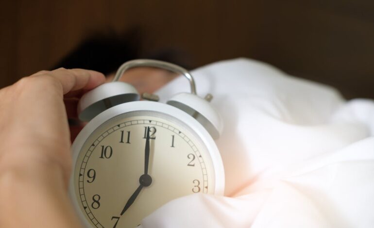 Free Photo of Person Holding Alarm Clock Stock Photo