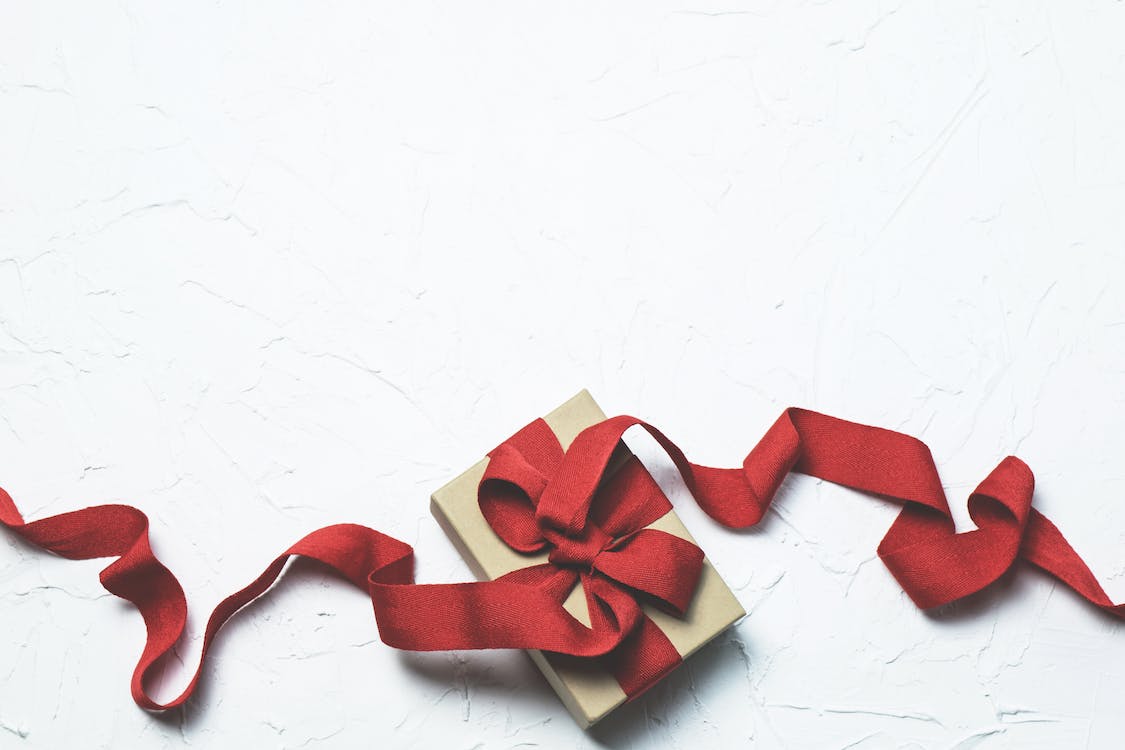 Free Red and White Gift Box With Ribbon Bow Stock Photo