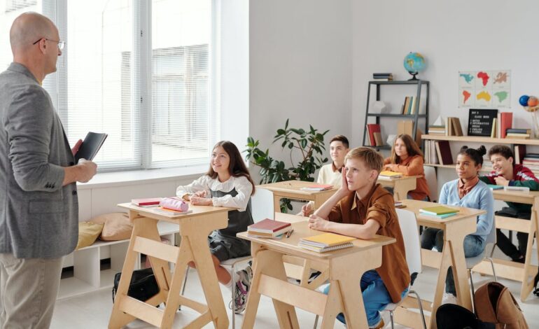 Free Students Sitting in the Classroom Stock Photo