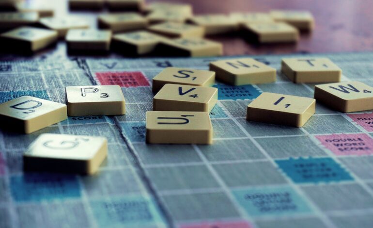 scrabble board game on shallow focus lens