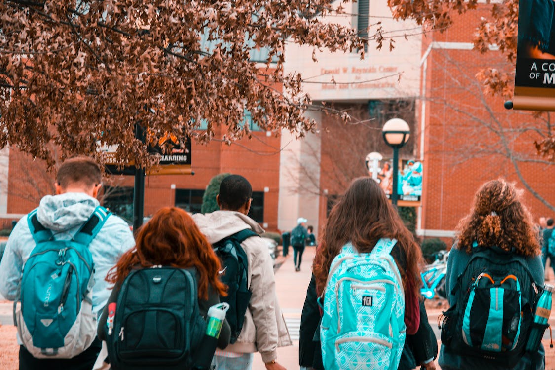 Free People Wearing Backpacks Stock Photo