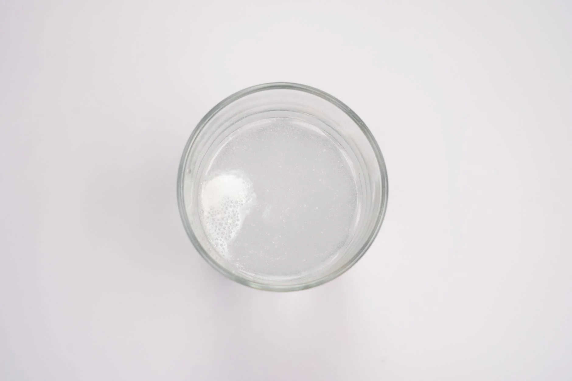 Effervescent tablet dissolving in a glass of water