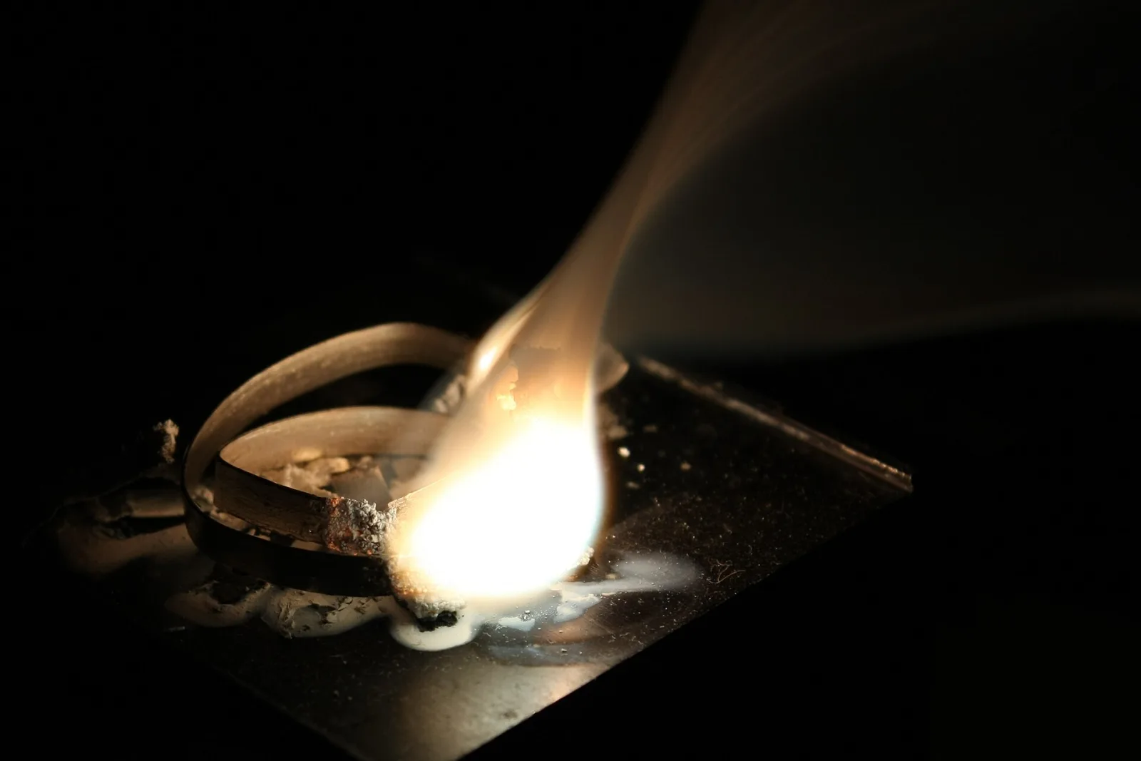 Burning magnesium ribbon giving off bright white light