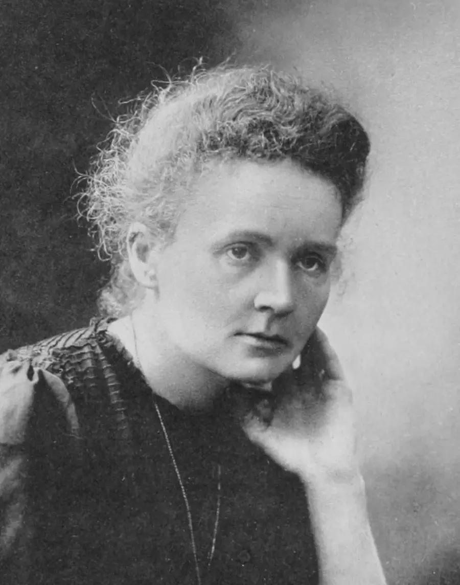 Black-and-white portrait of Marie Curie resting her head on her hand, from the Nobel archives