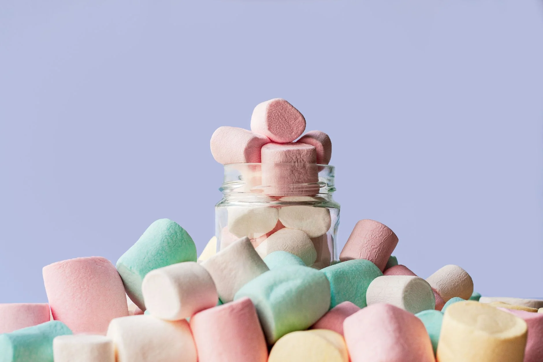 A jar of marshmallows on a table