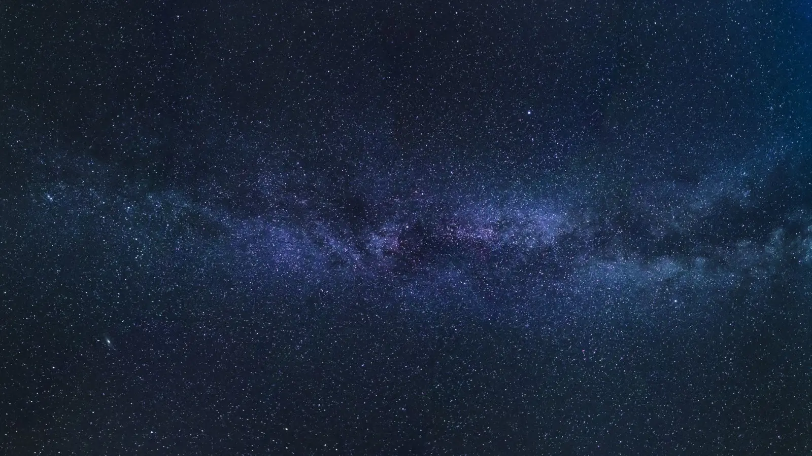 The band of the Milky Way across a dark starry sky
