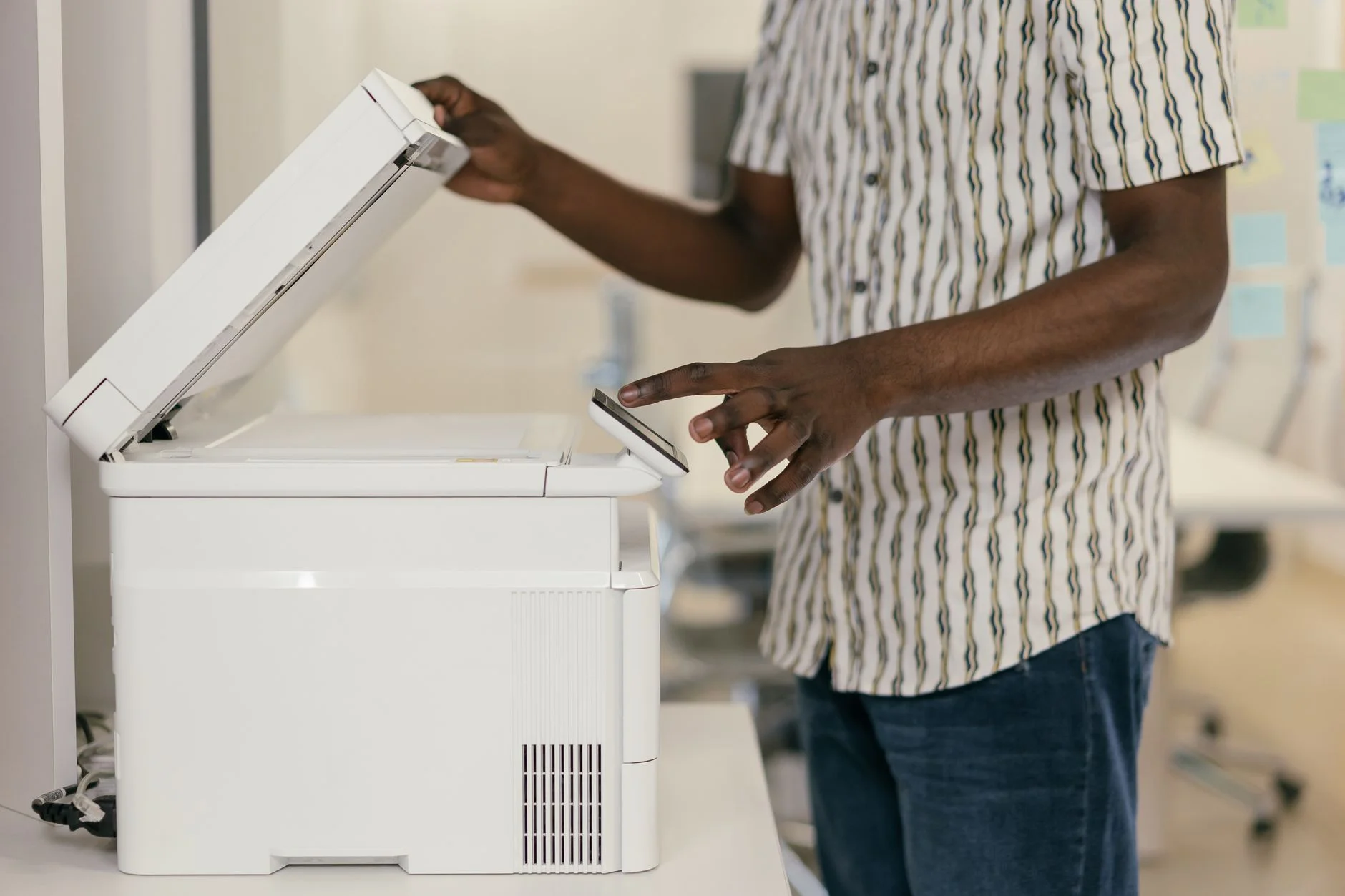 Person using an office photocopier