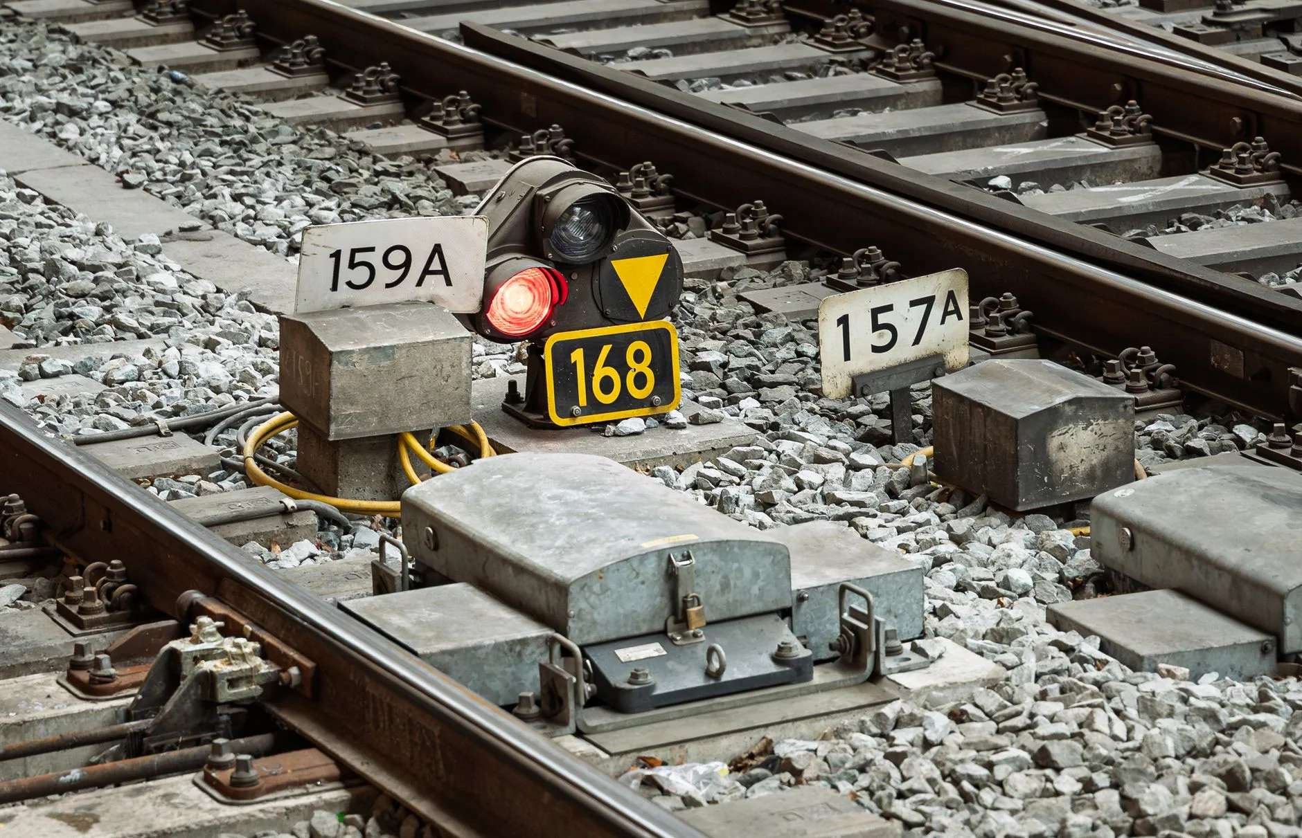 Railway points with switch machinery, signal and rails on ballast