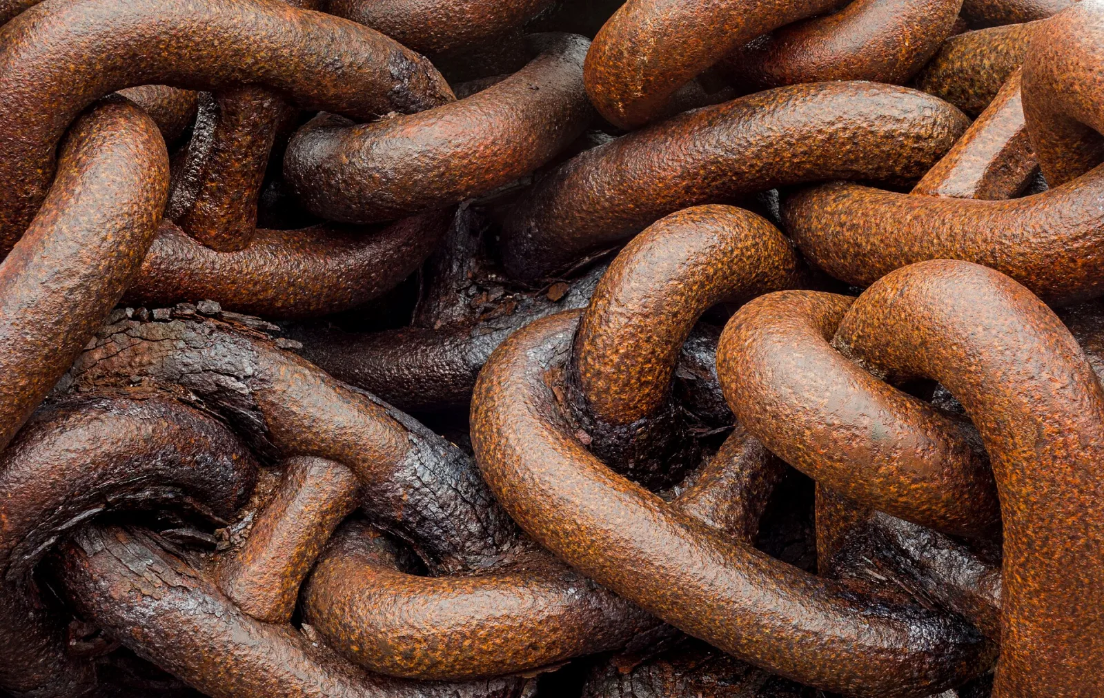 Heavily rusted iron chain links