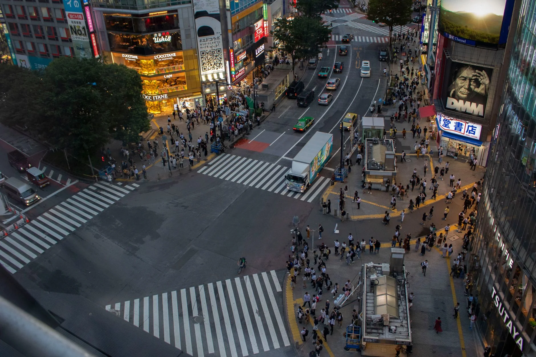 Aerial view of crowds crossing a busy road junction in Shibuya, Tokyo, Japan
