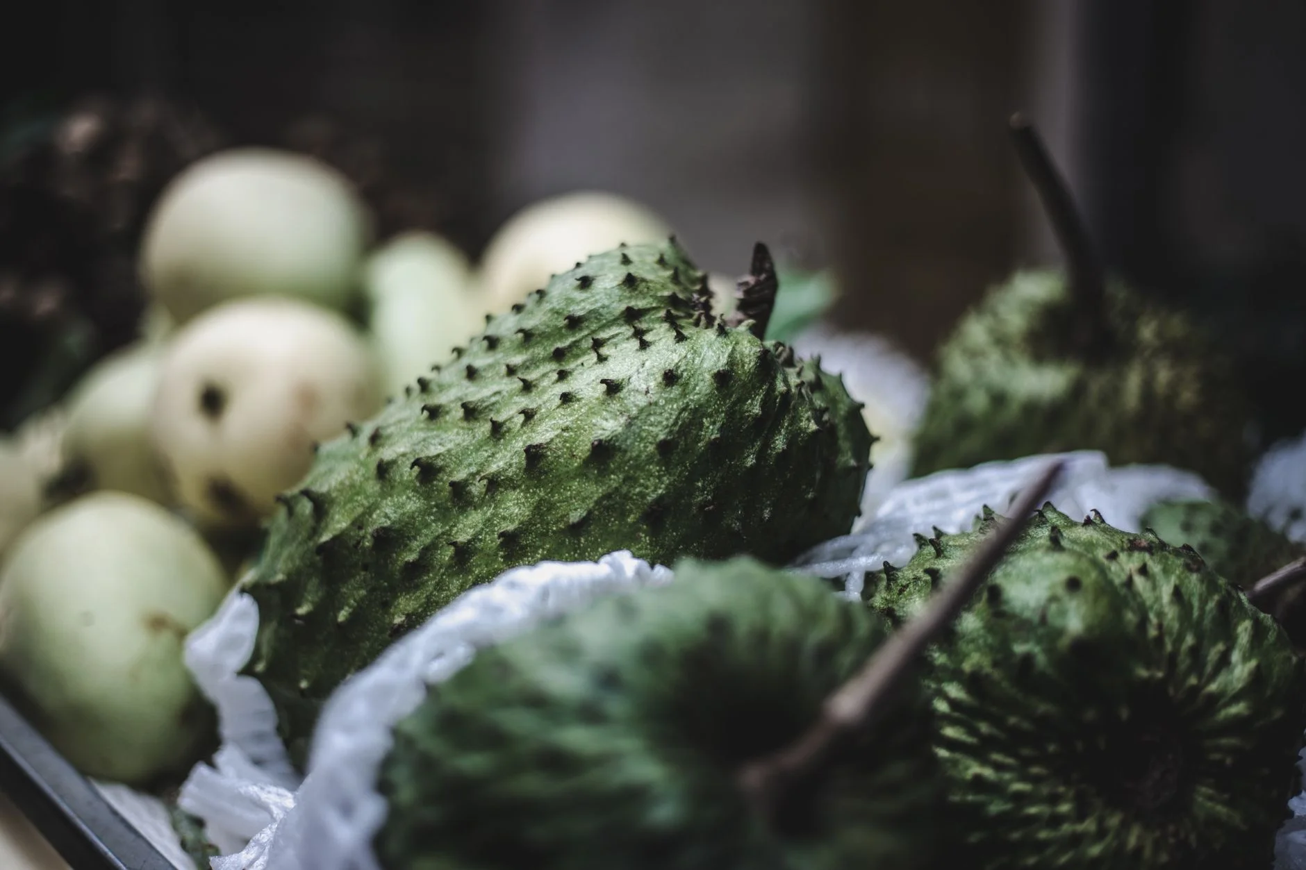 Soursop fruits for sale on a market stall in Hanoi