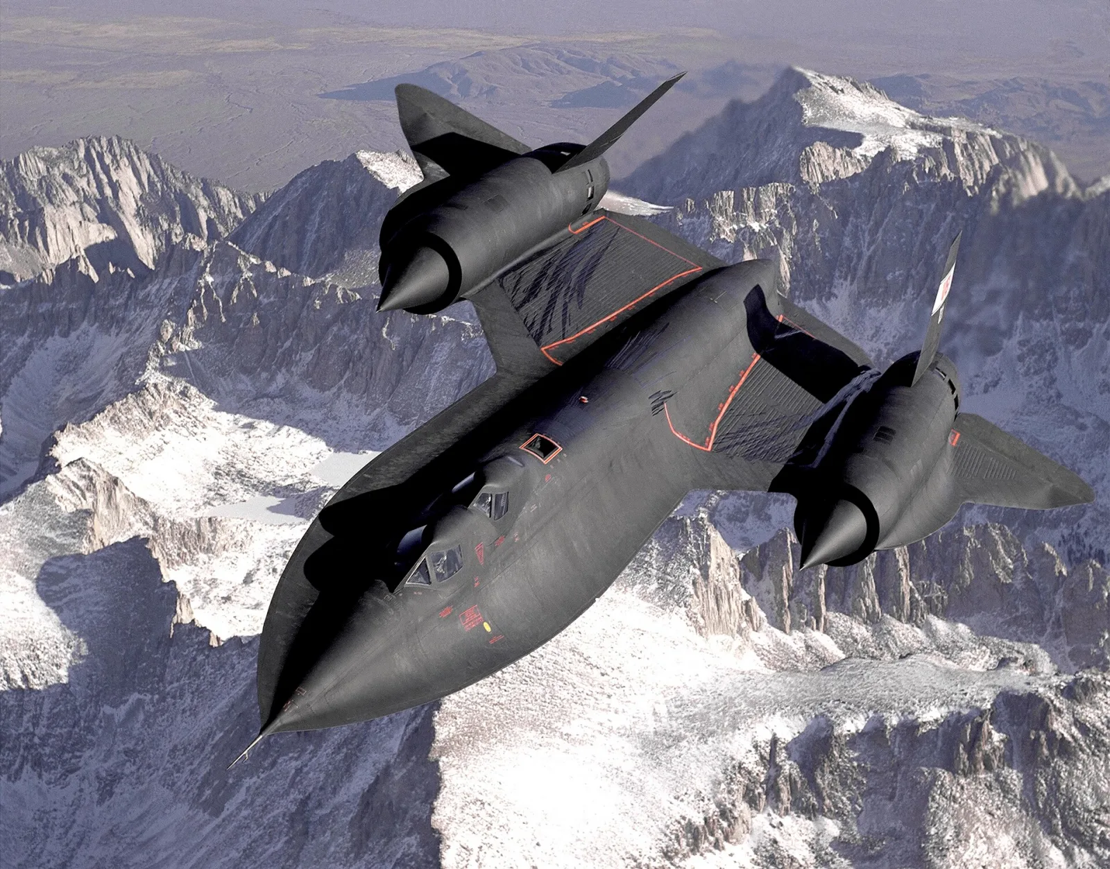 The black SR-71 Blackbird spy plane flying over snowy mountains