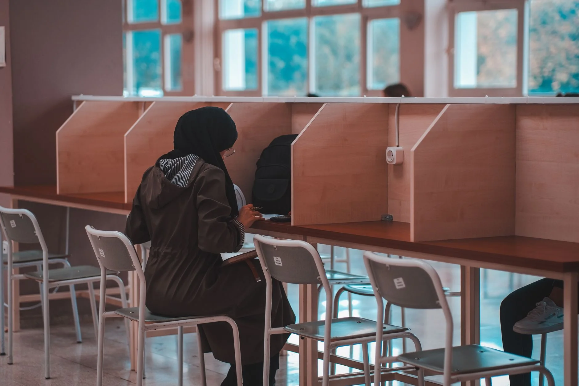 Student studying alone at a library desk
